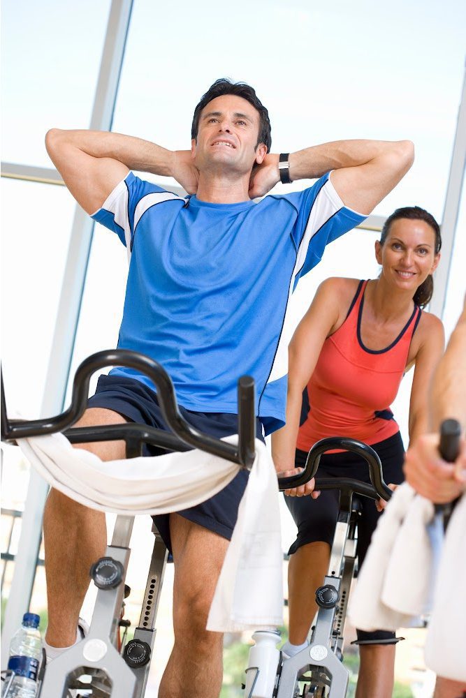 Tired man in spin studio